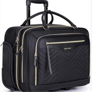 Light Flight quilted Black Travel rolling wheels.  Perfect carry on laptop bag.